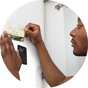 05d Engineer applying annual service sticker NAVIEN 1.png - Navien