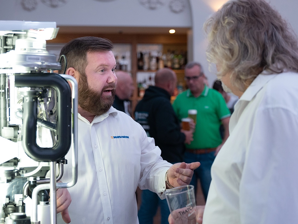 Barrie Wilson chatting to a prospect at a pub